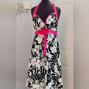 Black and white tropical halter dress. Has fushia bow details.